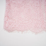 Elegant pink midi dress featuring floral embroidery and lace detailing with embellishments