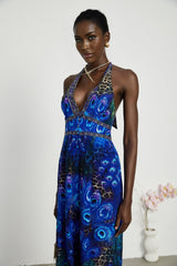 Elegant sleeveless silk jumpsuit with halter neckline in flowing fabric