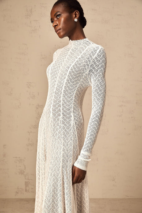 Elegant white maxi dress with allover wavy lace pattern and long sleeves