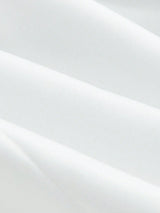 Elegant and versatile, this pristine white dress features a flattering, tailored fit that gracefully hugs the body while.