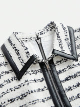 Elevate your style with this chic dress featuring a sophisticated blend of white and black hues, showcasing a textured.