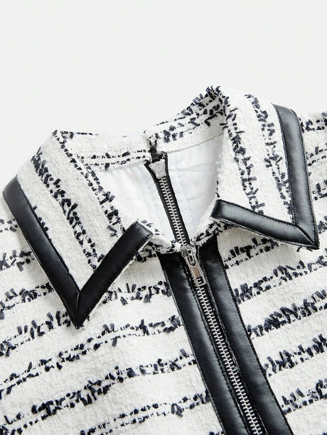 Elevate your style with this chic dress featuring a sophisticated blend of white and black hues, showcasing a textured.