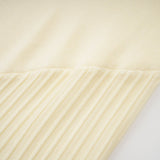 Émeline white knitted pleated midi dress
