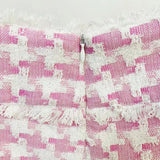 Pink houndstooth double-breasted blazer with silver buttons paired with matching high-waisted shorts