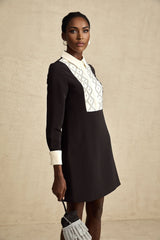 Esmee mini dress with contrasting color details and embellishments on a plain background