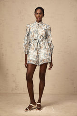 Eugenie blue jumpsuit with floral print lace trim and ruffles