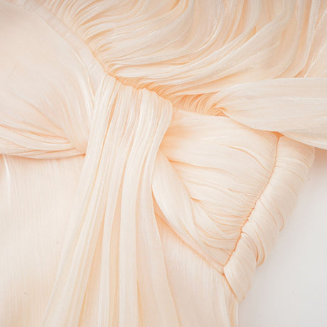 Eugenie pleated ruffled mini dress in neutral color with full skirt and delicate feminine details