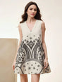 This chic sleeveless dress features a flattering V-neckline and a playful, flared silhouette, perfect for warm-weather.