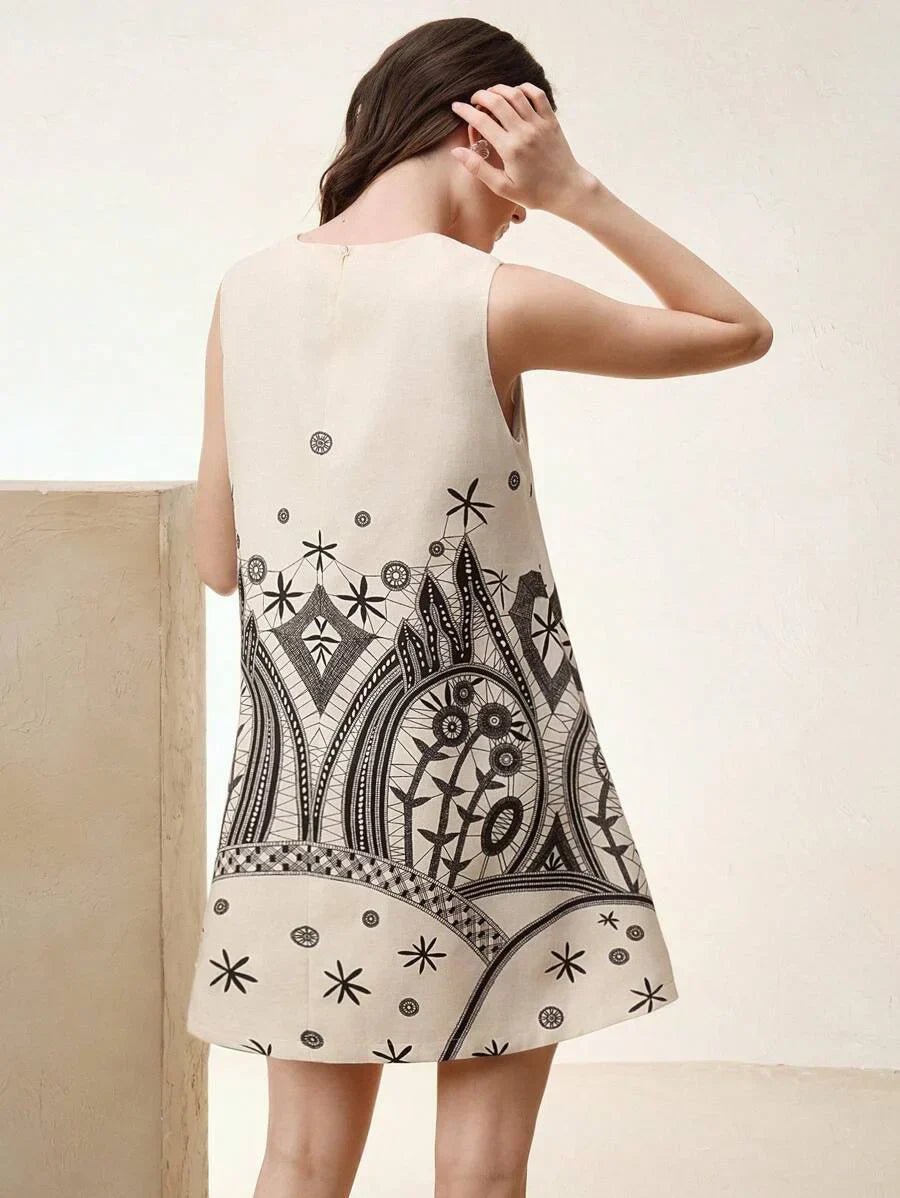 This stylish cream-colored dress features a trendy sleeveless design and a relaxed fit, adorned with intricate black.