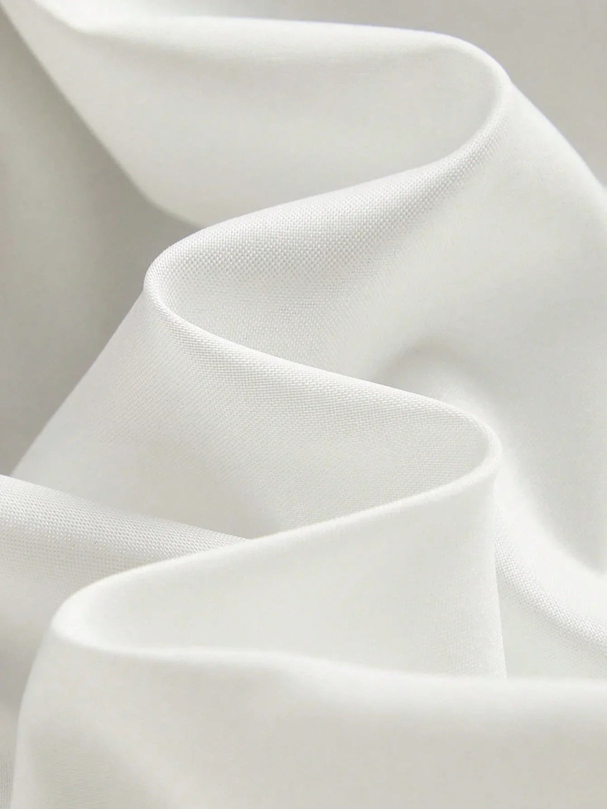 Experience the elegance of this flowing white dress, crafted from lightweight, breathable fabric that gently drapes for a.