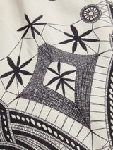 This stylish dress features a stunning black and white geometric pattern, crafted from a lightweight, breathable fabric that.