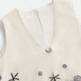 This elegant cream dress features a flattering V-neckline and delicate floral embroidery, combining a feminine aesthetic.