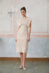 Fleur floral embroidered lace midi dress in neutral colors displayed on a mannequin or model against a plain background