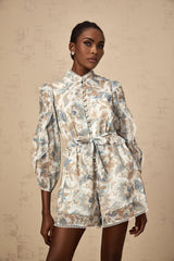 Floral print blue jumpsuit with lace trim and ruffles