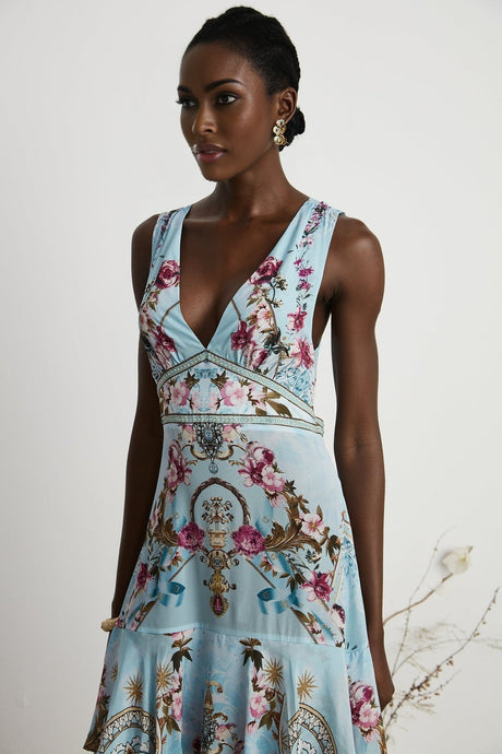 Floral print midi dress named Victoire with a vibrant pattern on a light background