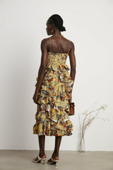 Floral print midi dress with tiered ruffles named Apolline on a white background