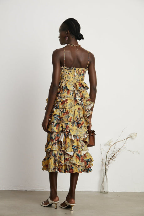 Floral print midi dress with tiered ruffles named Apolline on a white background