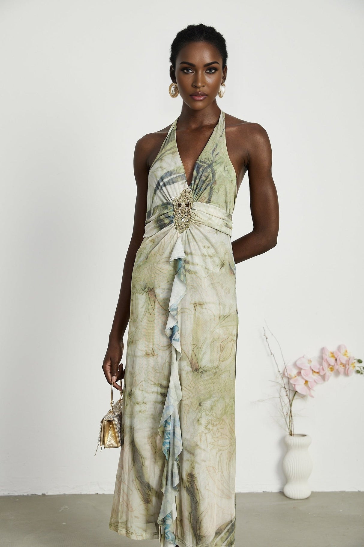 Flowy midlength dress with neckholder style and ombre print pattern fading from dark to light colors