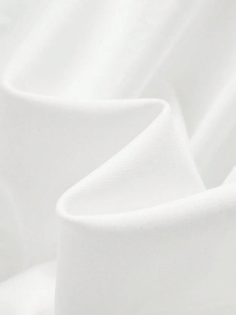 This stunning white dress features a soft, flowing fabric that drapes gracefully, creating an elegant and breathable fit.