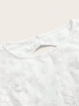 This delicate white dress features intricate floral embroidery, perfect for a romantic occasion. The elegant fit and.