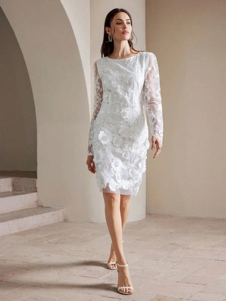 This elegant white dress features intricate floral lace detailing and a sophisticated fitted silhouette, accentuated by.