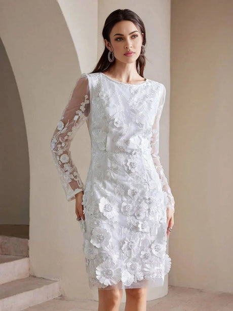 This elegant white dress features intricate floral embroidery and a chic silhouette with long sheer sleeves, ideal for.