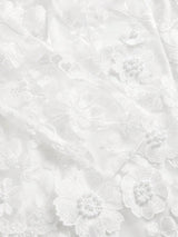 Delicate and ethereal, this stunning white dress features intricate floral embroidery adorned with pearl accents, creating a.