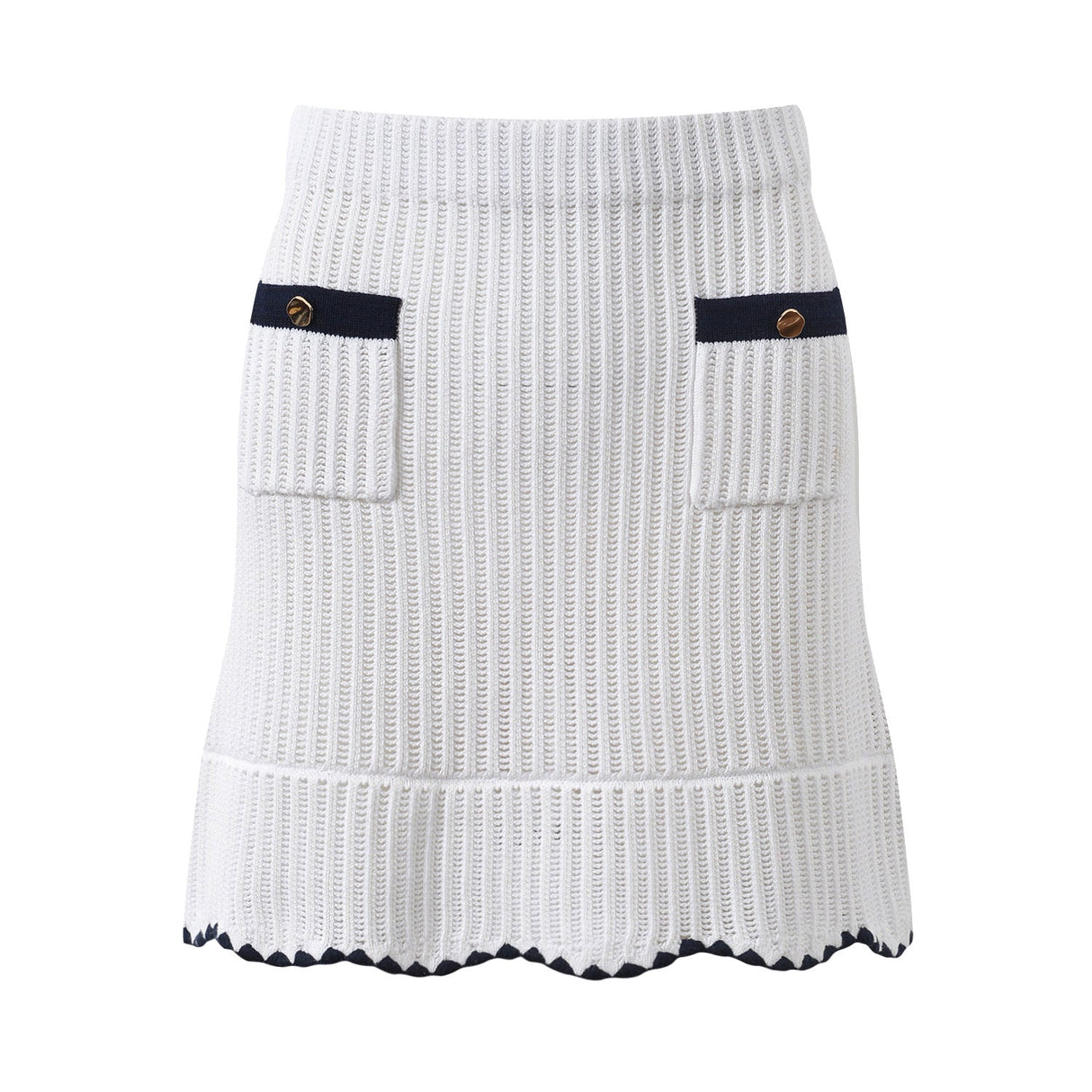 White knit cardigan with navy accents and gold buttons paired with a matching A-line skirt featuring a flared hem
