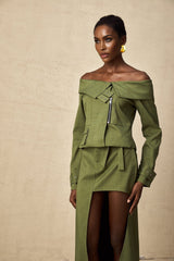 Green asymmetric jacket and skirt set named Elena featuring matching design elements