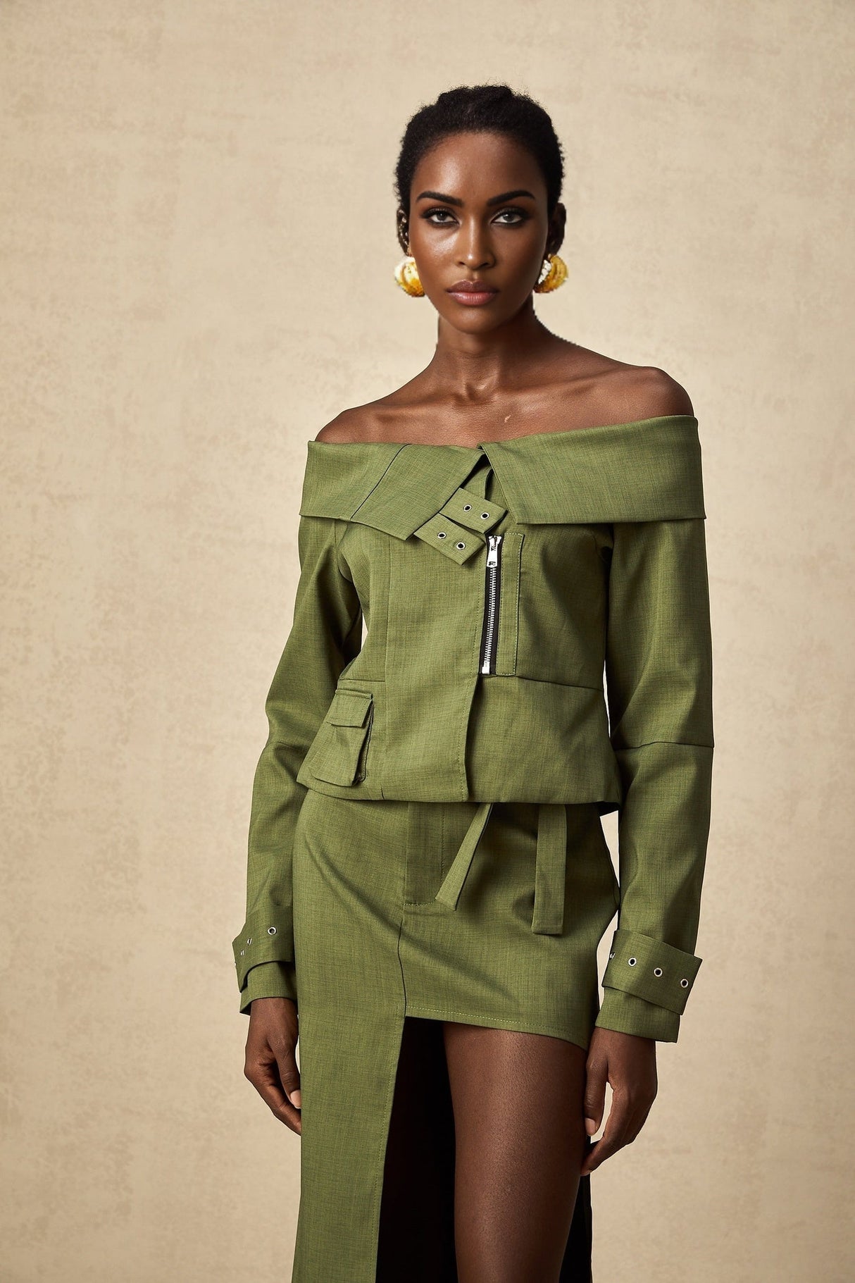 Green asymmetric jacket and skirt set named Elena featuring matching design elements