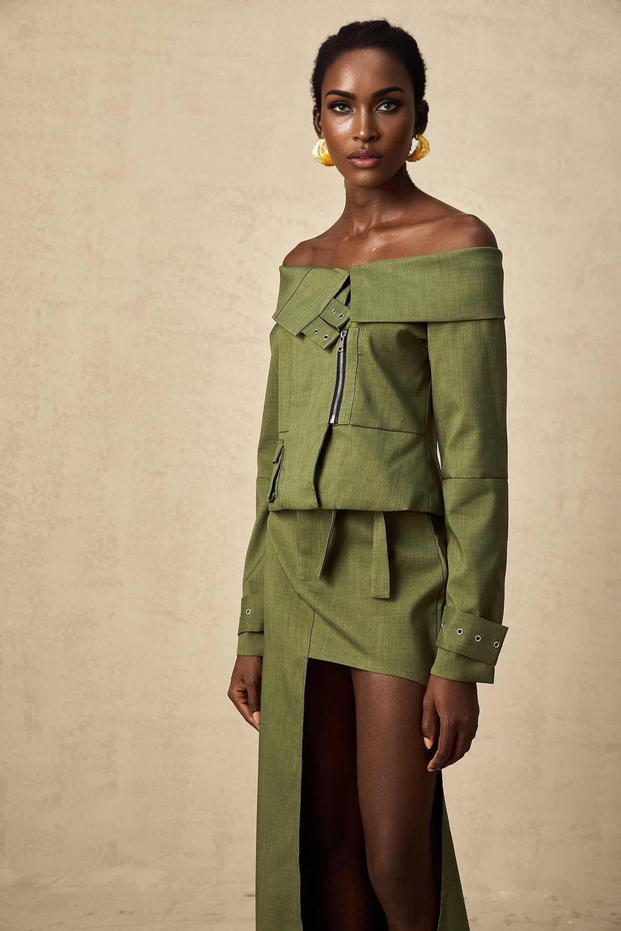 Green asymmetric jacket and skirt set named Elena featuring matching design