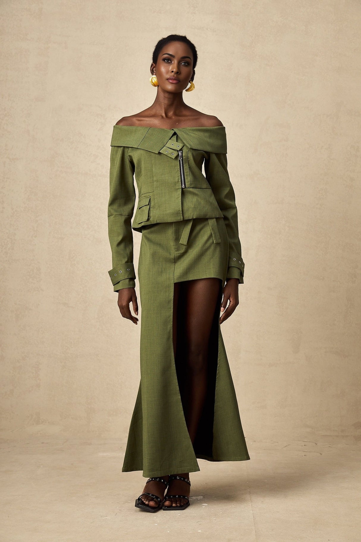 Green asymmetric jacket and skirt set named Elena featuring matching design