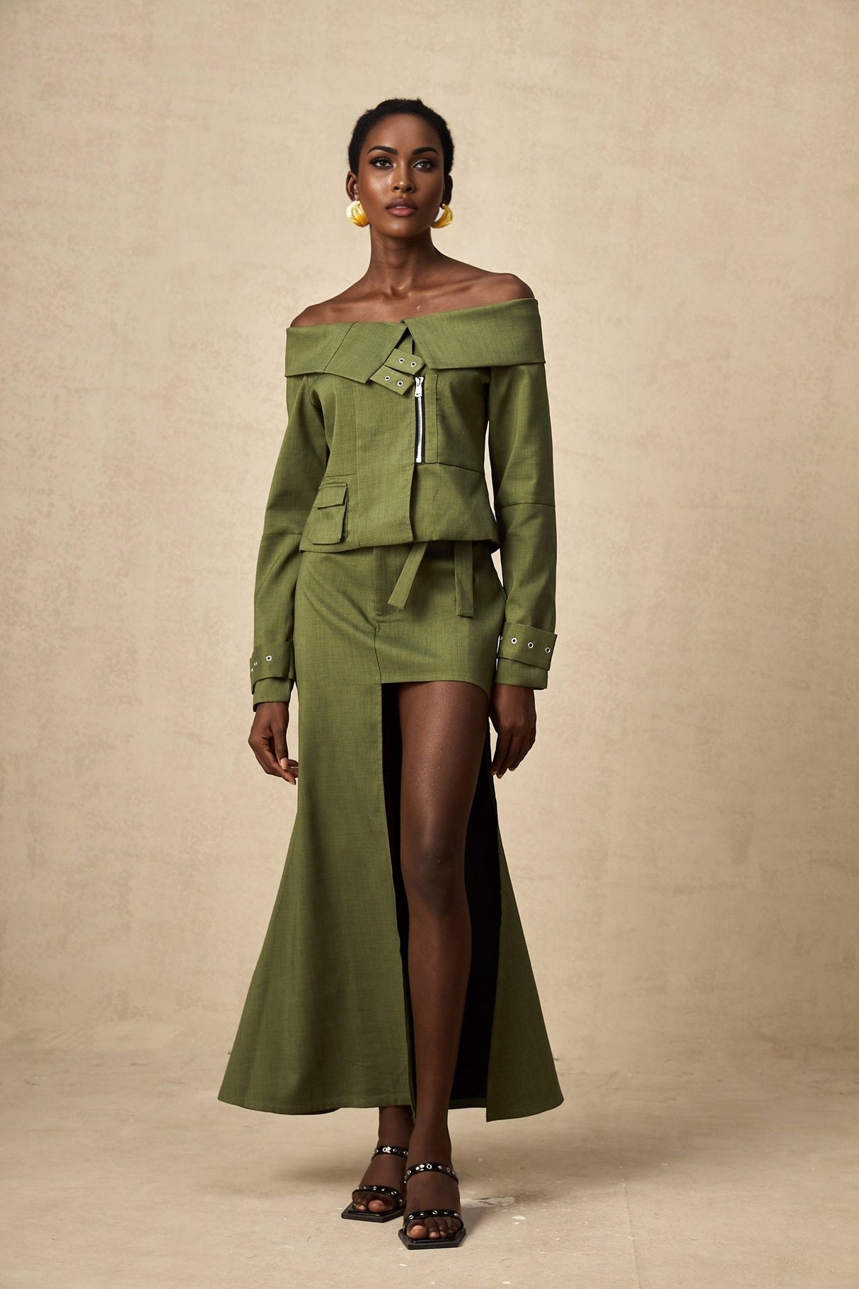 Green asymmetric jacket and skirt set named Elena featuring matching design