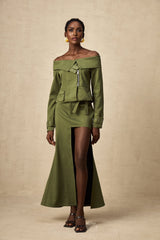 Green asymmetric jacket and skirt set named Elena featuring matching design