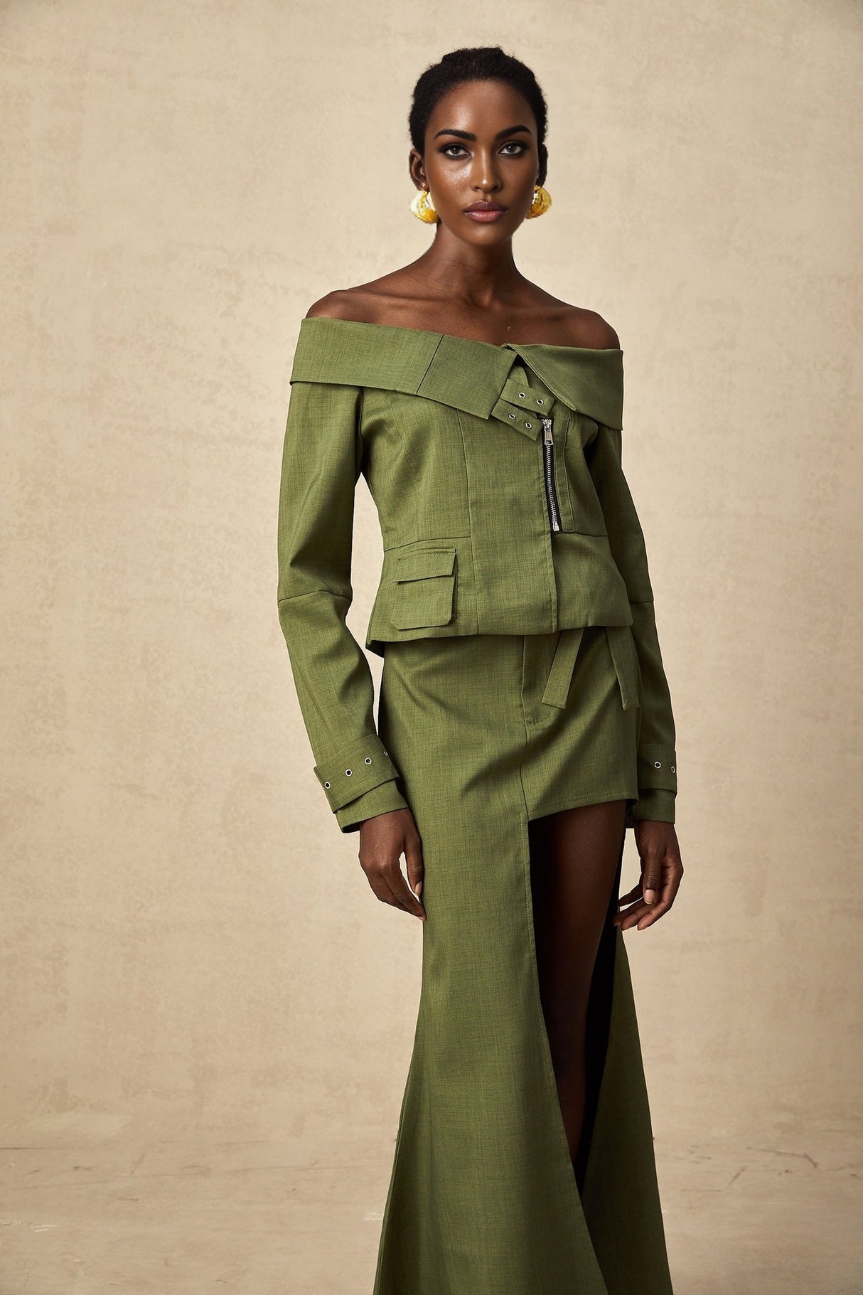 Green asymmetric jacket and skirt set named Elena featuring matching design