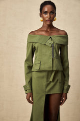 Green asymmetric jacket and skirt set named Elena featuring matching design
