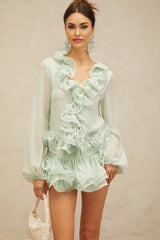 Green chiffon blouse and skirt set with flounced details