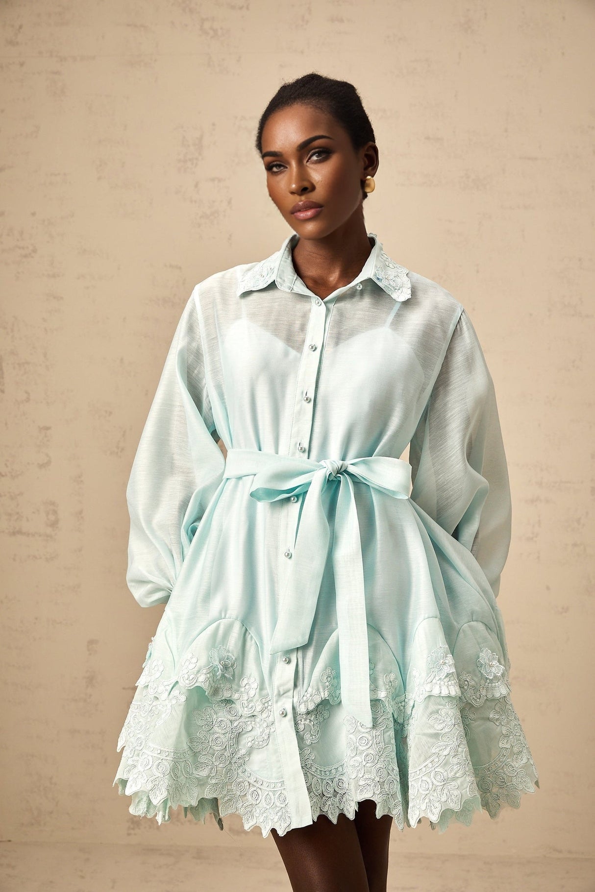 Green mini shirt dress with lace panel details featuring short sleeves and a collar