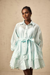 Green mini shirt dress with lace panel details featuring short sleeves and a collar