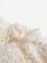 This elegant dress features a delicate ivory lace overlay, creating a romantic and ethereal look. The structured neckline.