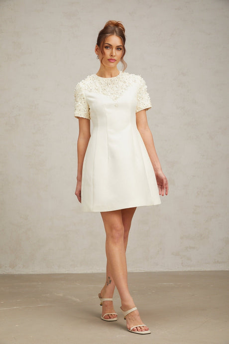 Heres a simple alt text for the product image based on the title

Adrienne mini dress with floral appliques on fabric short length sleeveless design feminine silhouette