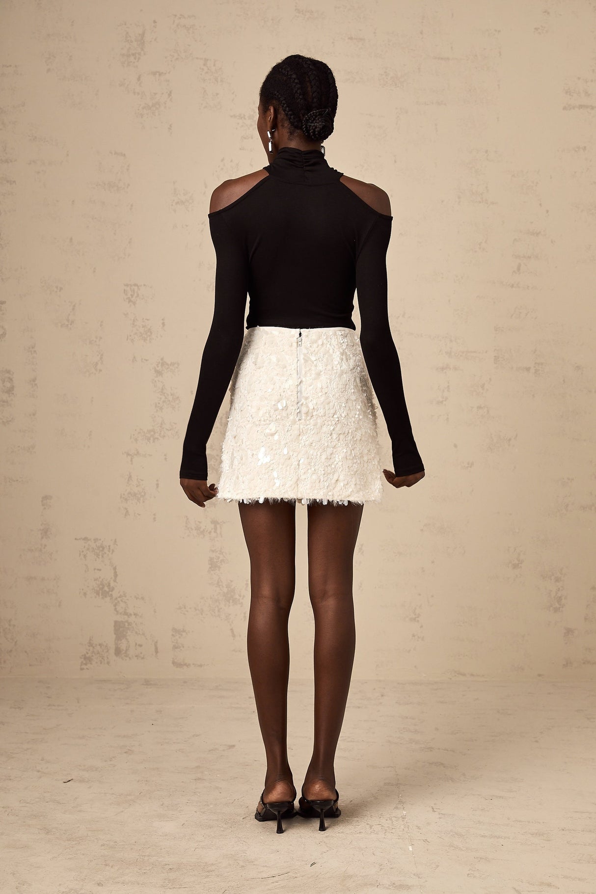 Heres a simple alt text for the product image based on the title

White mini skirt with sequin embellishment