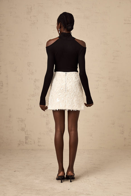 Heres a simple alt text for the product image based on the title

White mini skirt with sequin embellishment