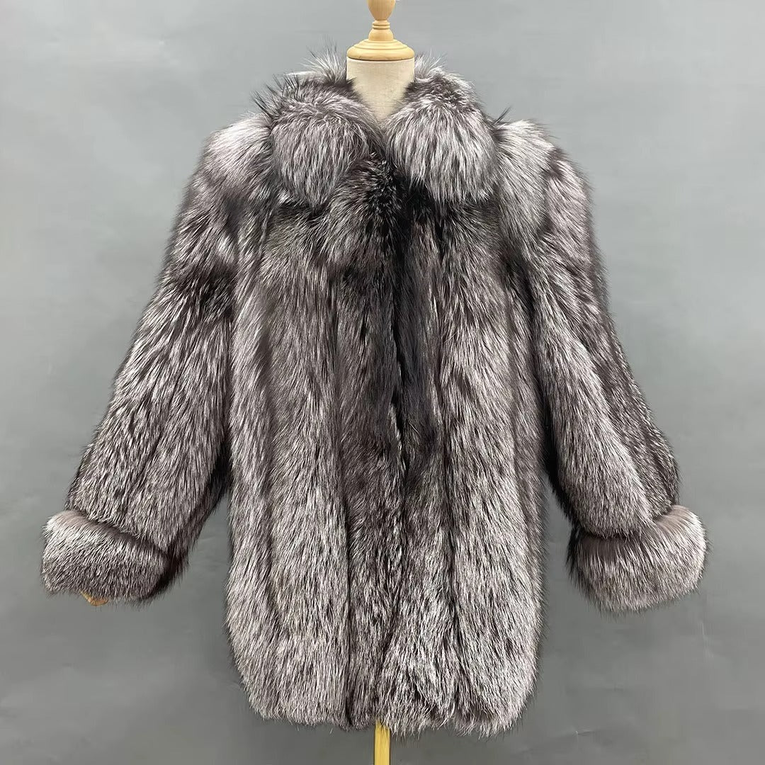 Gray fur coat on a mannequin against a gray background