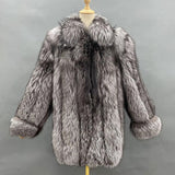 Gray fur coat on a mannequin against a gray background