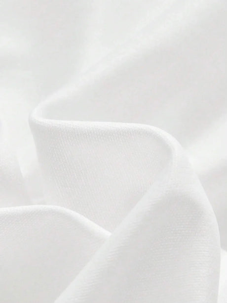 Luxurious and flowing, this elegant white dress is crafted from soft fabric that drapes beautifully, creating a flattering.