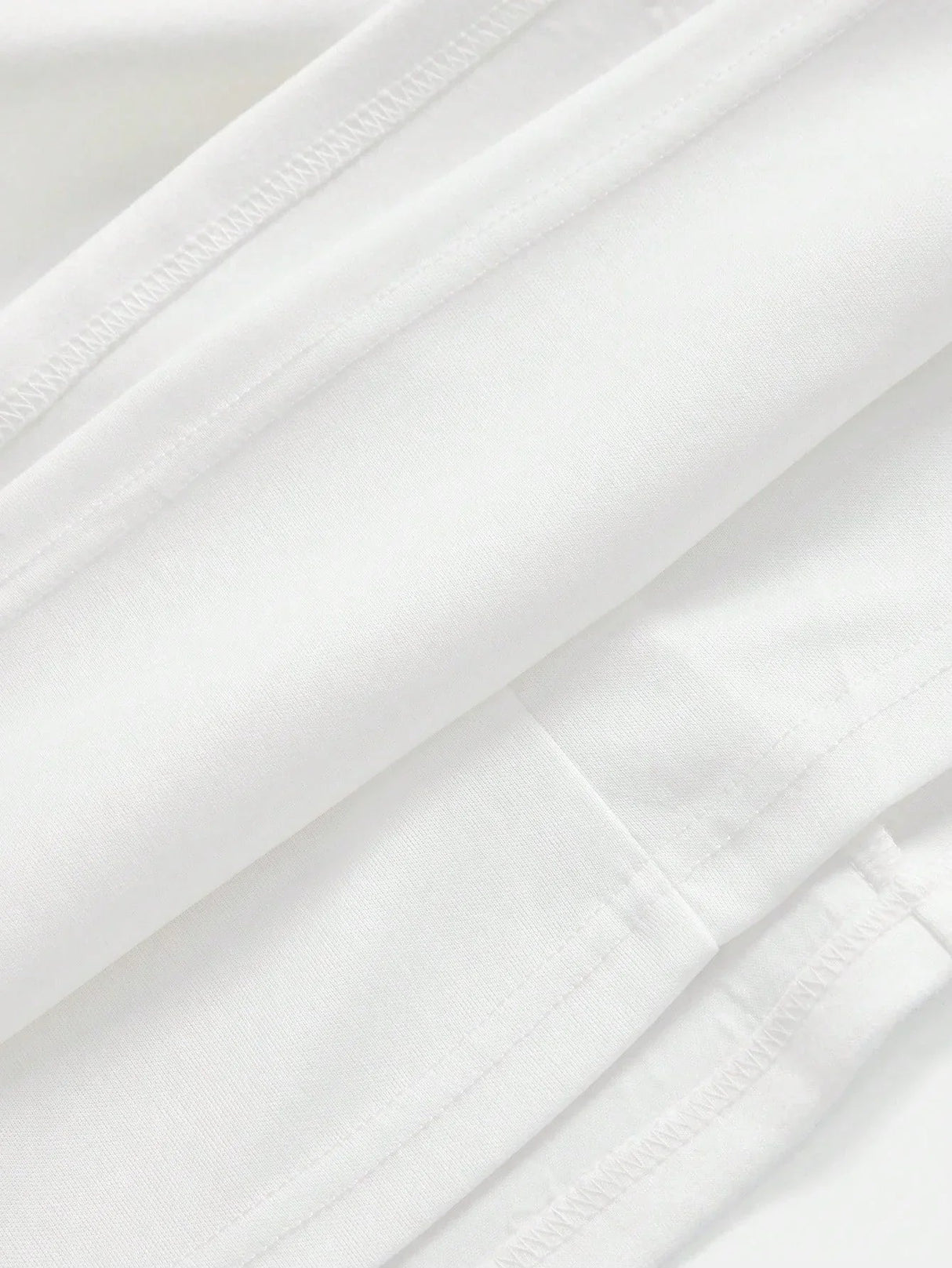 This elegant white dress features a sleek, form-fitting silhouette crafted from soft, breathable fabric, perfect for both.