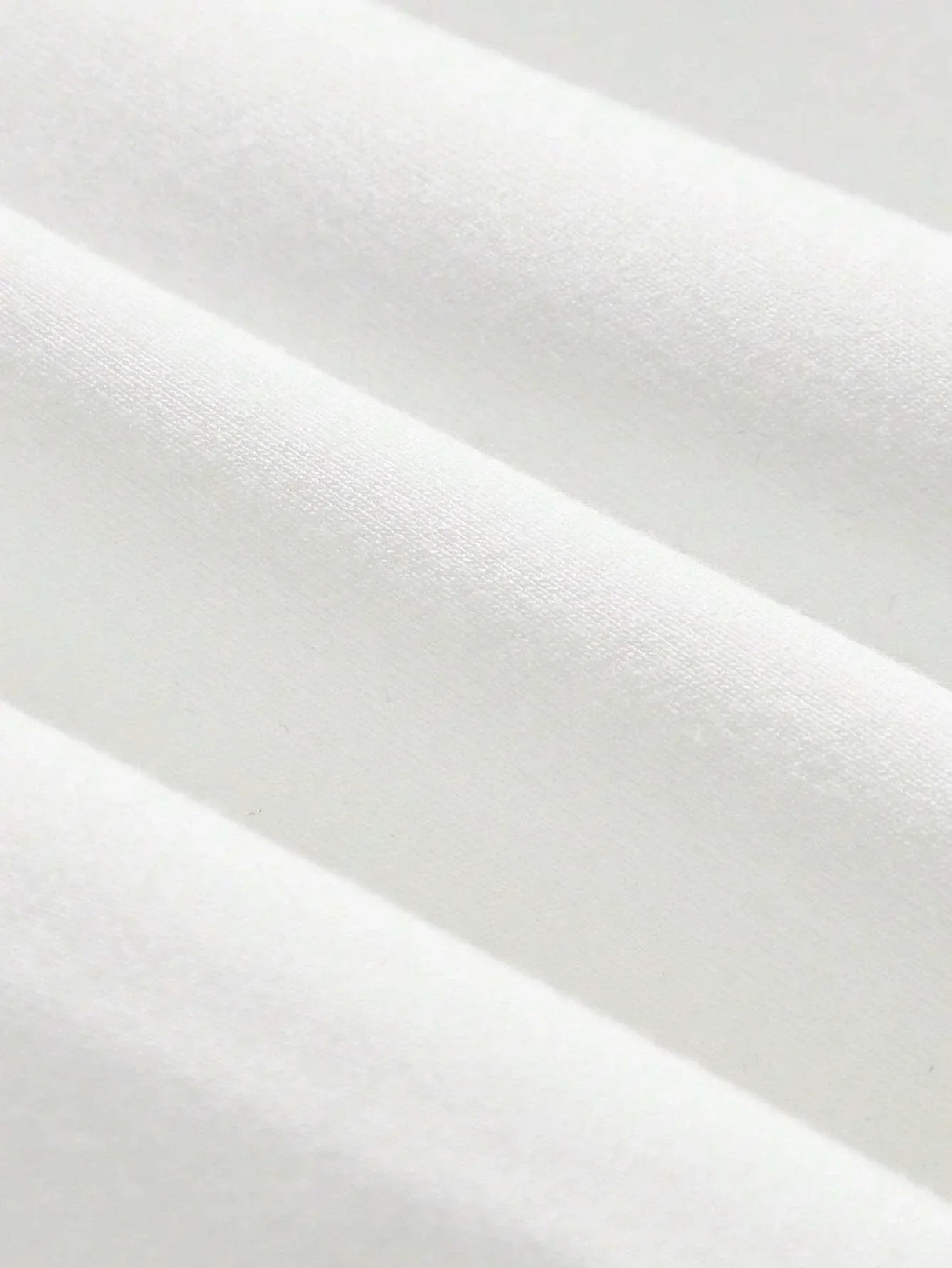 A soft, luxurious white dress crafted from a breathable cotton blend features a flattering fitted silhouette that gently.