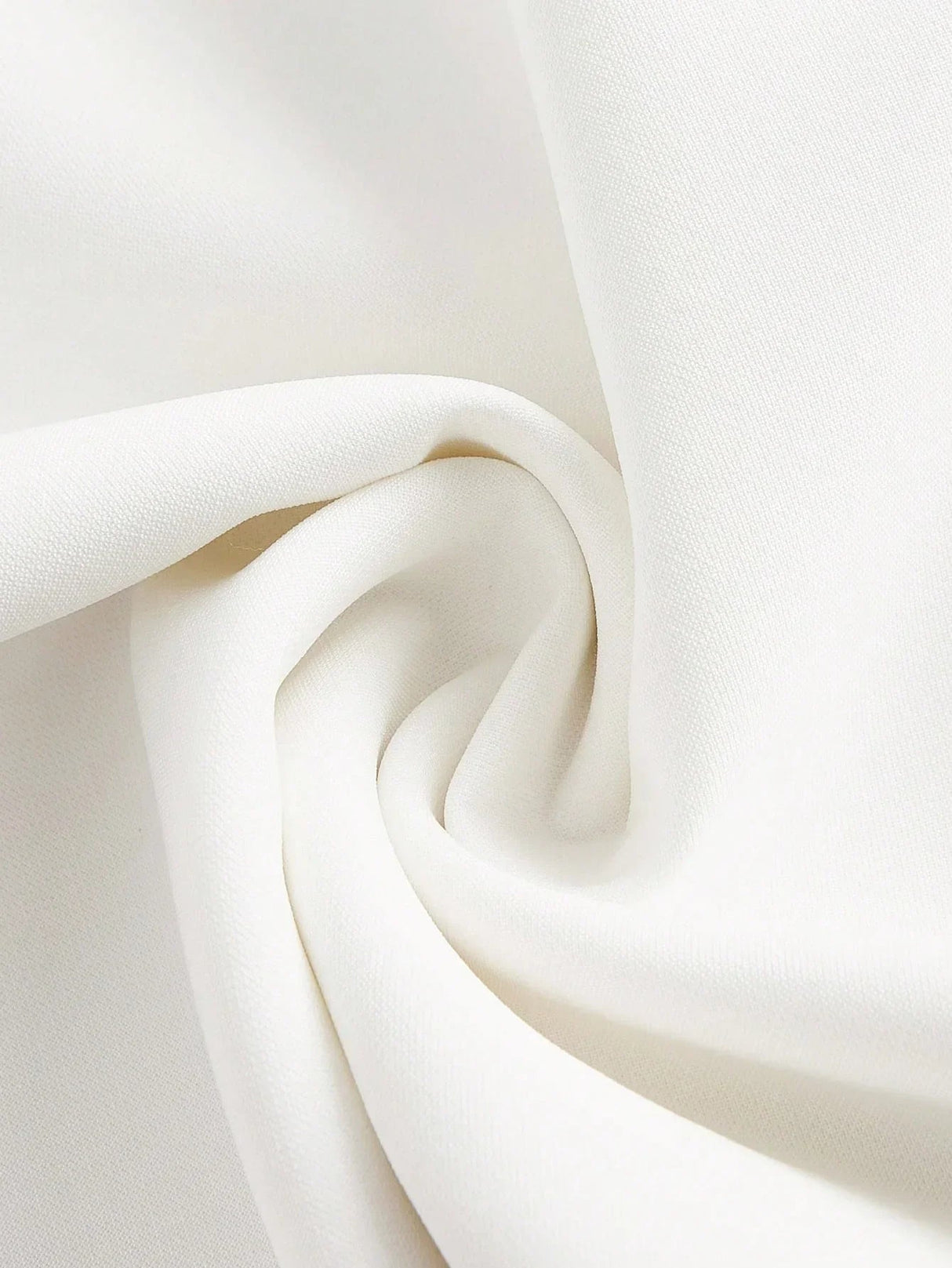 This elegant white dress features a smooth, lightweight fabric that drapes beautifully, creating a flattering silhouette..
