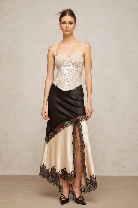 Karine bustier top with floral lace panelling against a plain background